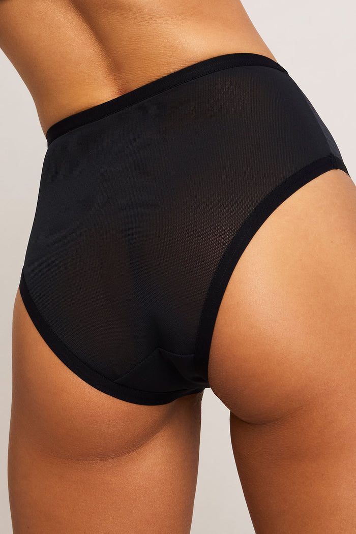 Black high-waist brief with sheer mesh side panel and full back coverage