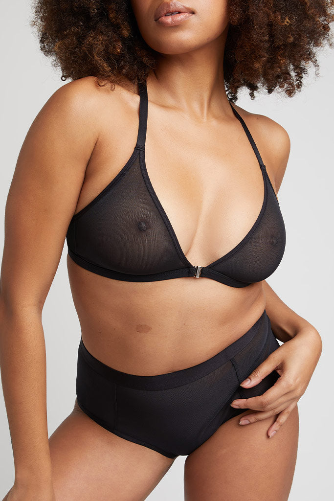 Black racerback bra with sheer mesh cups and adjustable shoulder straps