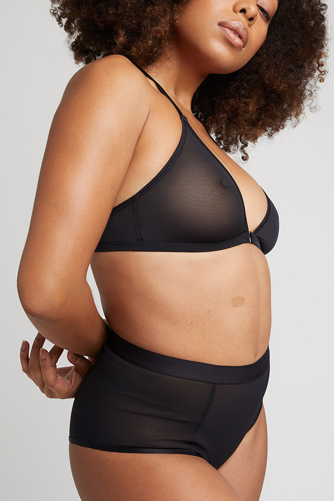 Black racerback bra with sheer mesh cup and wide underband