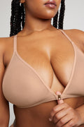 Buff racerback bra close-up of front hook closure and adjustable straps