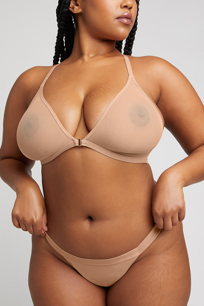 Buff racerback bra front view with adjustable straps and hook closure