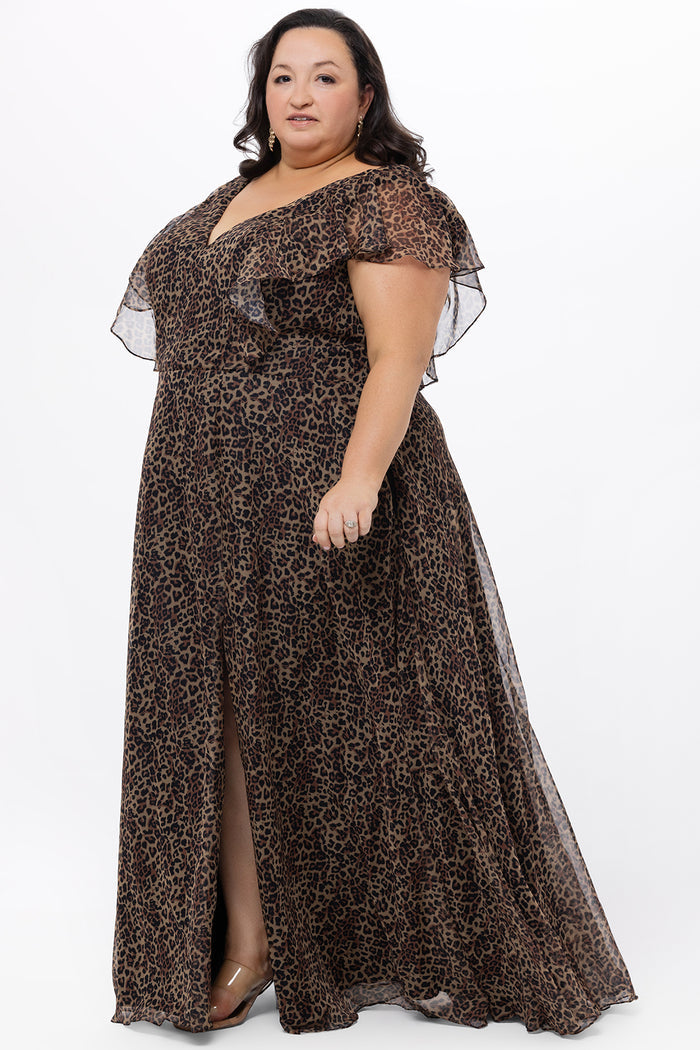Celebrations by Sydney's Closet style CE2606 in animal print. 

Long plus size animal print dress.  V-neck, short flutter sleeves, natural waistline, pockets and ruffles on bodice princess seams. Left leg slit. Made from printed chiffon and light satin lining. High scoop back and center back zipper.