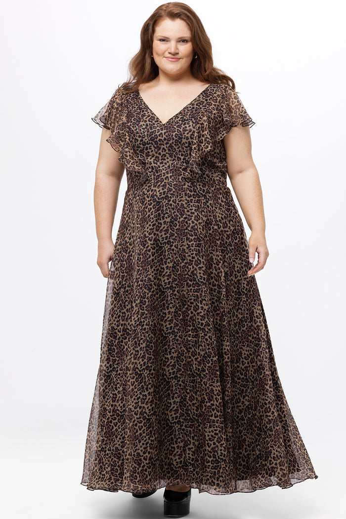Celebrations by Sydney's Closet style CE2606 in animal print. 

Long plus size animal print dress.  V-neck, short flutter sleeves, natural waistline, pockets and ruffles on bodice princess seams. Left leg slit. Made from printed chiffon and light satin lining. High scoop back and center back zipper.