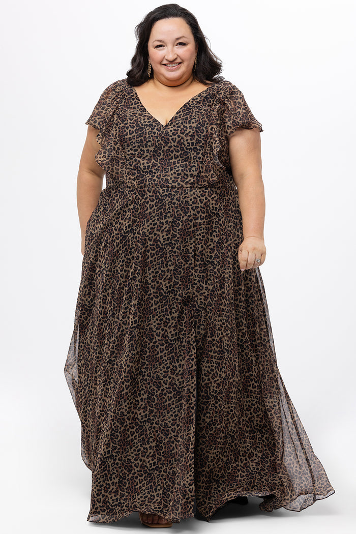 Celebrations by Sydney's Closet style CE2606 in animal print. 

Long plus size animal print dress.  V-neck, short flutter sleeves, natural waistline, pockets and ruffles on bodice princess seams. Left leg slit. Made from printed chiffon and light satin lining. High scoop back and center back zipper.