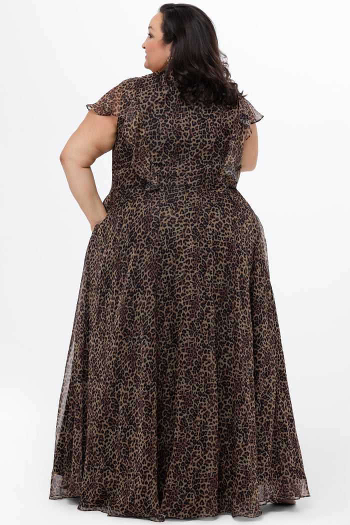 Celebrations by Sydney's Closet style CE2606 in animal print. 

Long plus size animal print dress.  V-neck, short flutter sleeves, natural waistline, pockets and ruffles on bodice princess seams. Left leg slit. Made from printed chiffon and light satin lining. High scoop back and center back zipper.