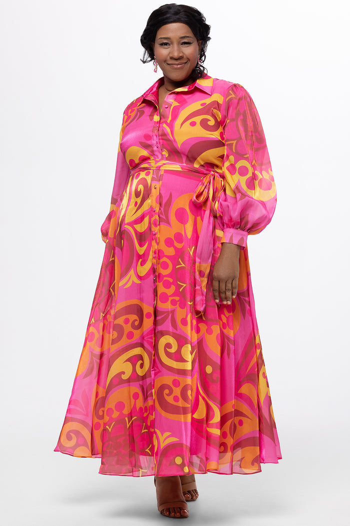 Celebration's by Sydney's Closet style CE2622 in abstract print. 

Button down plus size ankle length gown made from printed organza. V-neck, long pouf sleeves with cuff and optional belt. A-line skirt with pockets.