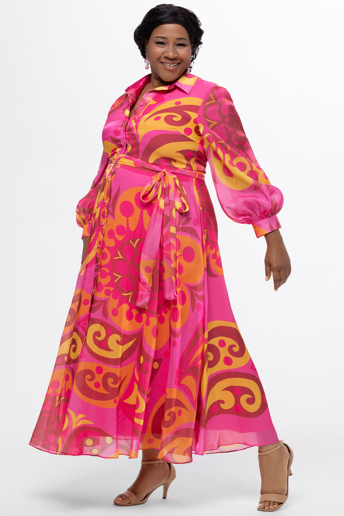 Celebration's by Sydney's Closet style CE2622 in abstract print. 

Button down plus size ankle length gown made from printed organza. V-neck, long pouf sleeves with cuff and optional belt. A-line skirt with pockets.