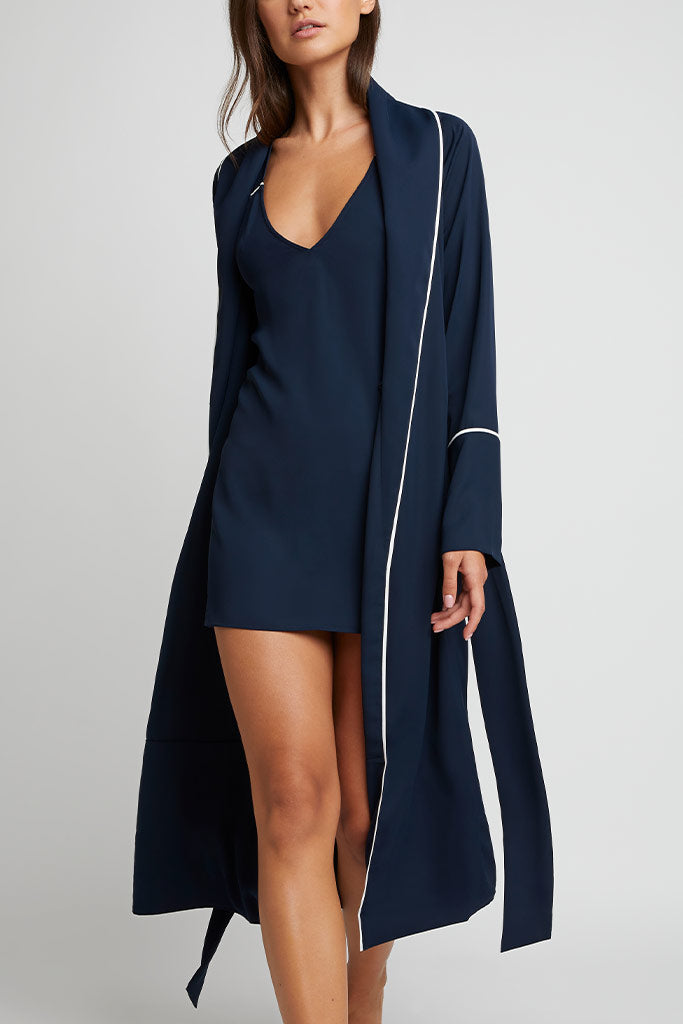 Navy robe with long sleeves, open front, and white piping edge detailing