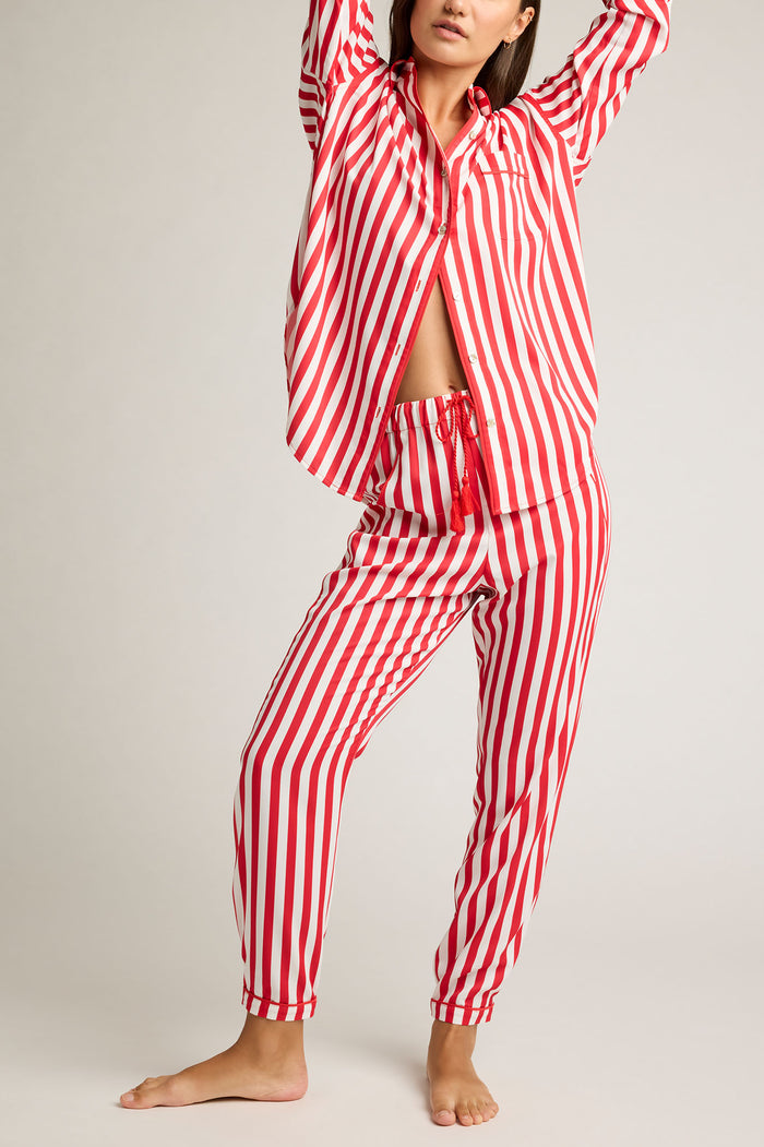 Red and white striped jogger pants with elastic ankle cuffs