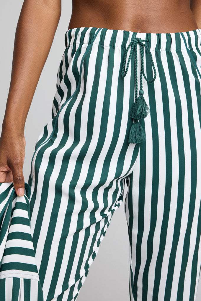 Striped jogger pants with drawstring tie, tassel accents, and elastic waistband