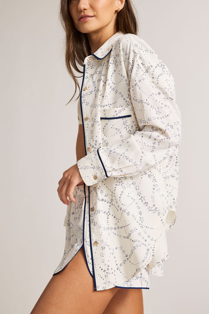Celestial-print short with navy trim and front button placket