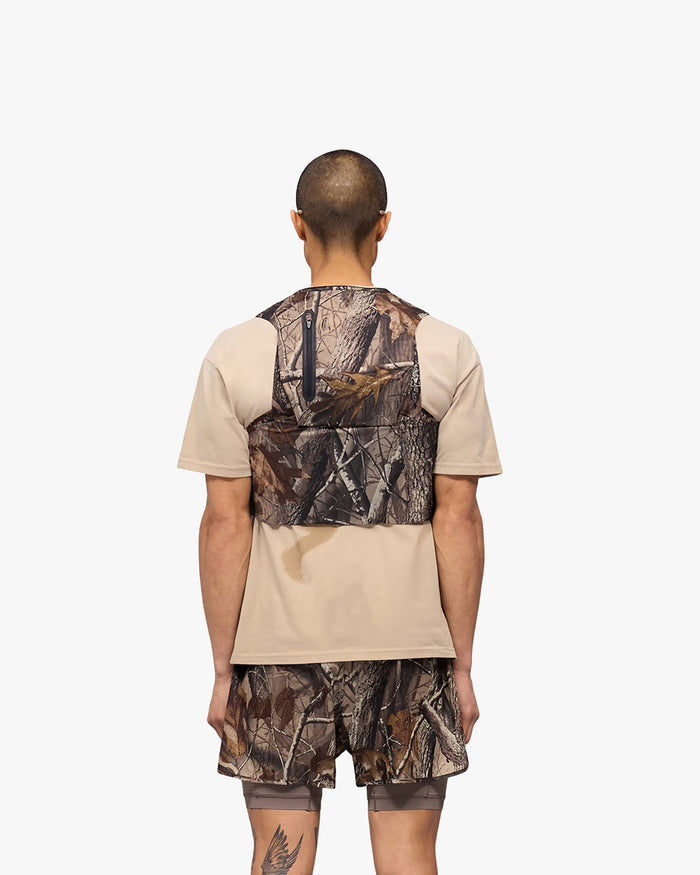 Product image of a mens camo chest rig on a plain white background | Team 247 Chest Rig in Realtree | Accessories with magnetic buckles and multiple pockets | 247 Accessories | Represent Clo
