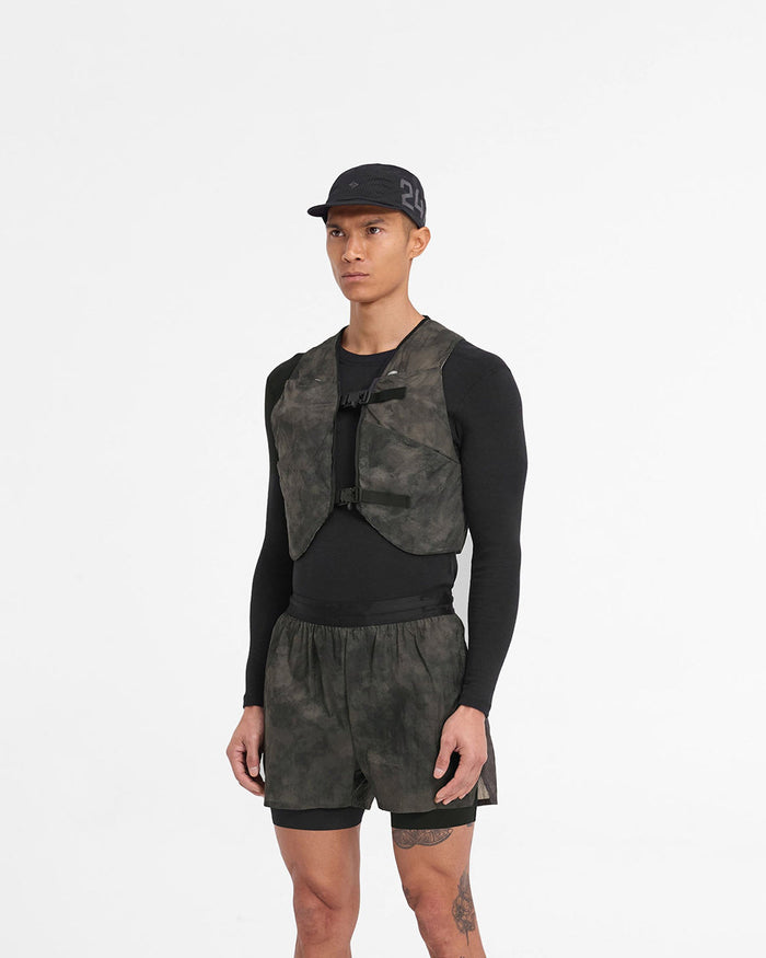 Man wearing a chest rig in terrain color on a plain white background | Team 247 Chest Rig in Terrain | Mesh outer chest rig with magnetic buckles and multiple pockets | 247 Accessories | Represent Clo
