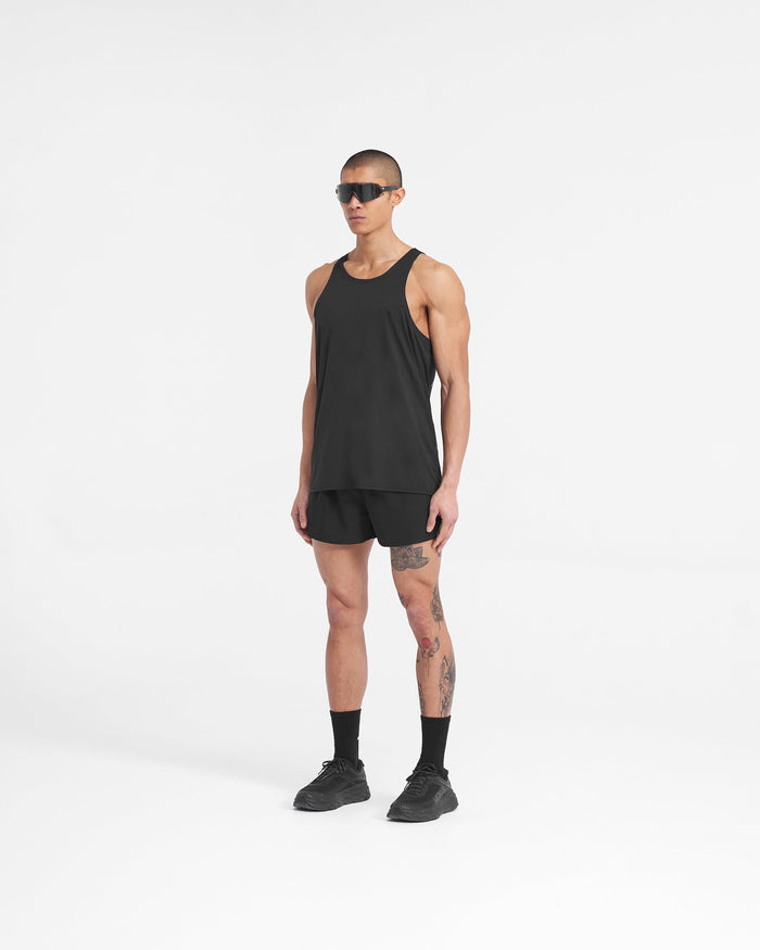Man wearing black polyester shorts on a plain white background | Team 247 Race Shorts in Jet Black | Shorts with large side split and zip pocket | 247 Shorts | Represent Clo