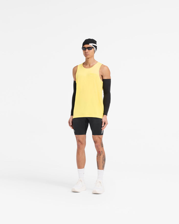 Man wearing a yellow running vest on a plain white background | Team 247 Run Vest in Lemon | Running vest with breathable mesh fabric | 247 T-Shirts | Represent Clo