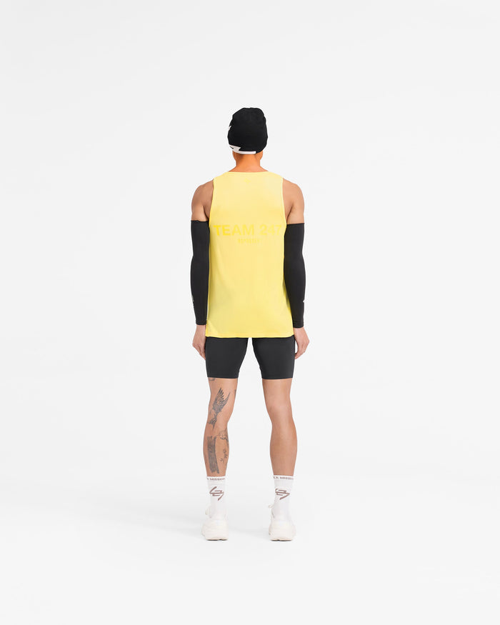Man wearing a yellow run vest on a plain white background | Team 247 Run Vest in Lemon | Lightweight breathable running vest | 247 T-Shirts | Represent Clo