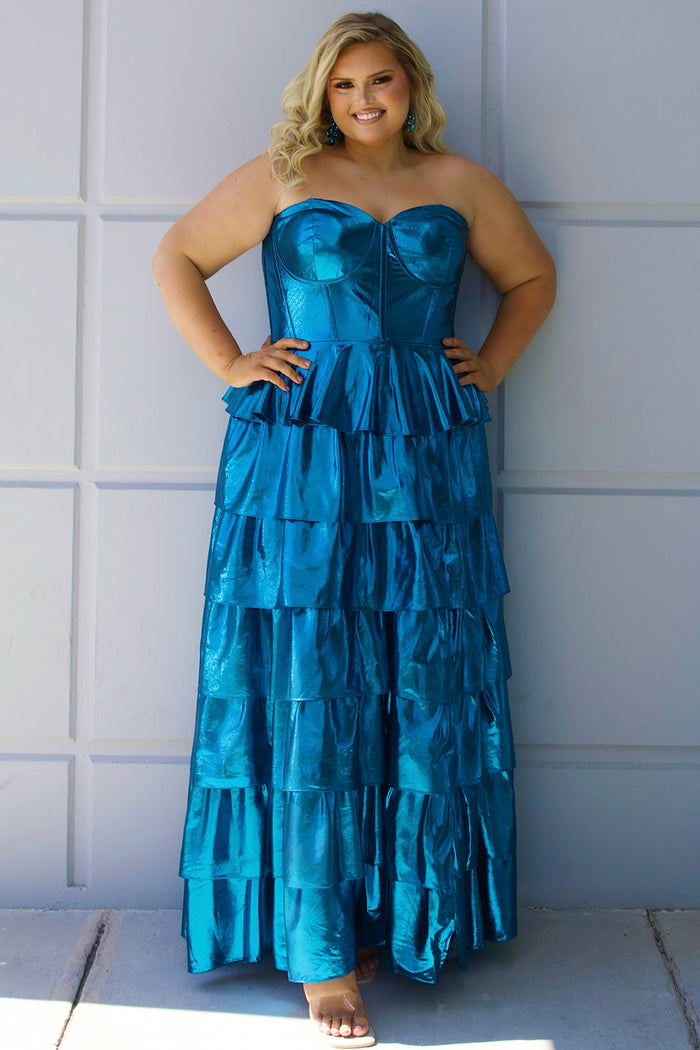 SC7405 by Sydney's Closet. Plus size strapless sweetheart metallic knit gown with exposed boning on bodice.  Tiered A-line skirt slit. Available in magenta pink, copper gold/brown and turq blue green.