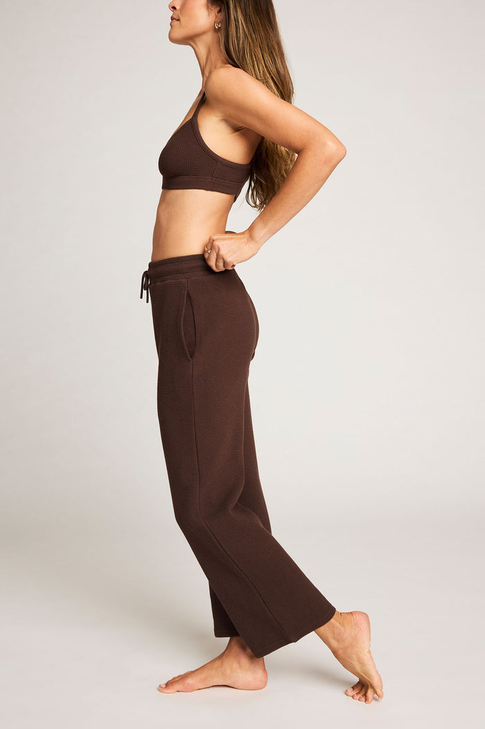 Espresso waffle-knit bralette with thin straps, worn with matching lounge pants