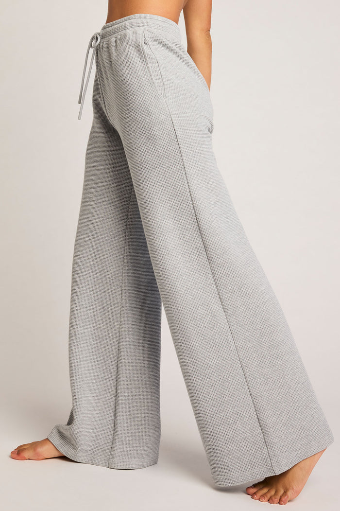Heather grey waffle knit track pants, side view, relaxed wide straight legs
