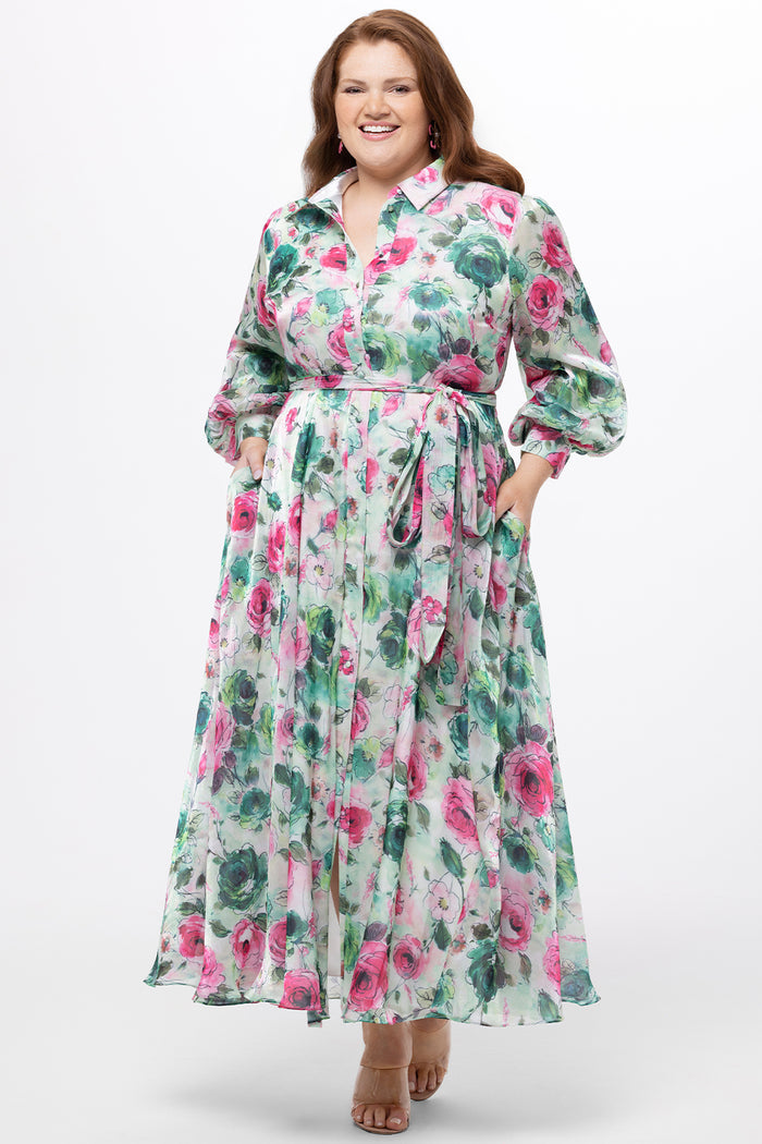 Celebration's by Sydney's Closet style CE2621 in floral. 

Button down plus size ankle length floral gown made from printed organza. V-neck, long pouf sleeves with cuff and optional belt. A-line skirt with pockets.