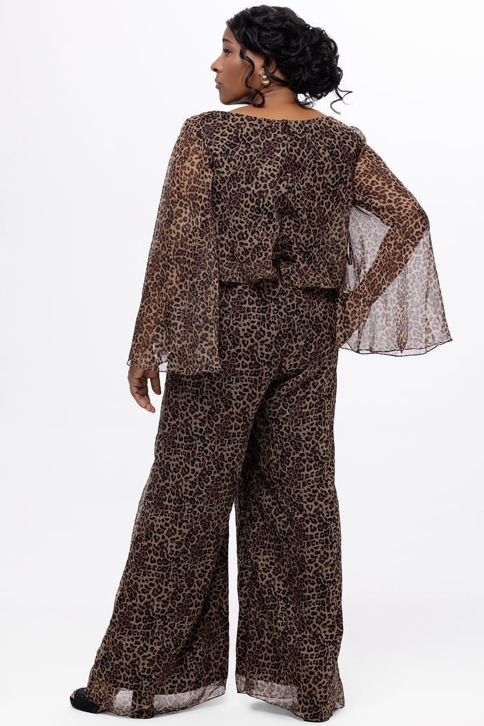 Plus size one-piece animal print jumpsuit. Long flowy chiffon sleeves and blouson bodice, elastic waist, and wide-leg pants. Center back zipper and scoop neckline. CE2607 available in sizes 14-28 in animal print. Celebration's by Sydney's Closet.