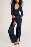 Navy track pants with gathered waist and wide straight legs, full-length